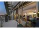 Relax on this unit's balcony with chair and enjoy city views through large sliding glass doors at 2001 Lincoln St # 2412, Denver, CO 80202