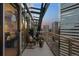 Relax on this building's balcony with stunning city views and comfortable outdoor furniture at 2001 Lincoln St # 2412, Denver, CO 80202