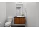Modern bathroom featuring a floating vanity with vessel sink, toilet, and sleek mirror at 2001 Lincoln St # 2412, Denver, CO 80202