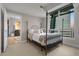 Inviting bedroom with four-poster bed and large windows showcasing city views at 2001 Lincoln St # 2412, Denver, CO 80202