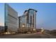 High-rise condo building boasting modern architecture and stunning city views at dusk at 2001 Lincoln St # 2412, Denver, CO 80202