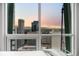 Breathtaking city and mountain views seen through large bedroom windows at 2001 Lincoln St # 2412, Denver, CO 80202