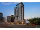Exterior view of a tall, modern building surrounded by other high-rise structures at 2001 Lincoln St # 2412, Denver, CO 80202