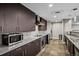 Contemporary kitchen with granite countertops, stainless steel appliances, and ample cabinet space at 2001 Lincoln St # 2412, Denver, CO 80202
