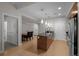 Bright kitchen features stainless steel appliances, an island with a sink, and modern pendant lighting at 2001 Lincoln St # 2412, Denver, CO 80202
