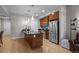 This modern kitchen has stainless steel appliances, a dark countertop, and wooden cabinetry at 2001 Lincoln St # 2412, Denver, CO 80202