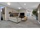 Cozy lounge area with a fireplace, comfortable seating, and a large-screen TV at 2001 Lincoln St # 2412, Denver, CO 80202