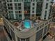 Stunning rooftop pool and lounging area offering city views at 2001 Lincoln St # 2412, Denver, CO 80202