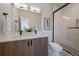 Modern bathroom with double sinks, a spacious glass-enclosed shower, and contemporary fixtures at 1372 Lowell Blvd # 1, Denver, CO 80204