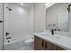 Stylish bathroom featuring a shower-tub combo and modern vanity with white countertop at 1372 Lowell Blvd # 1, Denver, CO 80204