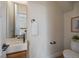 A modern powder bathroom boasts a square sink, and a white towel at 1372 Lowell Blvd # 1, Denver, CO 80204