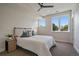 Bright bedroom featuring large windows and a comfortable bed with stylish pillows and a ceiling fan at 1372 Lowell Blvd # 1, Denver, CO 80204
