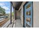 Modern entryway with blue front door, sleek design, and exterior view at 1372 Lowell Blvd # 1, Denver, CO 80204