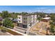 Aerial view of modern home with landscaping and city skyline in the background at 1372 Lowell Blvd # 1, Denver, CO 80204
