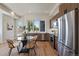 Modern kitchen and dining area featuring stainless steel appliances and fixtures at 1372 Lowell Blvd # 1, Denver, CO 80204