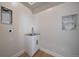 Functional laundry room with a sink, cabinetry, and convenient utility hookups at 1372 Lowell Blvd # 1, Denver, CO 80204
