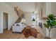 Cozy living room with a modern fireplace and stylish decor with light-colored floors and staircase at 1372 Lowell Blvd # 1, Denver, CO 80204