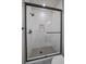 Sleek shower featuring glass enclosure and modern fixtures at 1372 Lowell Blvd # 1, Denver, CO 80204