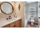 Well-lit bathroom with a stylish vanity, modern fixtures, and a shower-tub combo at 16376 Flintlock Ct, Parker, CO 80134