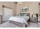 Serene bedroom with neutral tones, a ceiling fan, and a view of the outdoors at 16376 Flintlock Ct, Parker, CO 80134