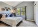 Cozy bedroom with ample light and view of surrounding greenery at 16376 Flintlock Ct, Parker, CO 80134