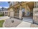 A view of a porch showcasing a cozy rocking chair and stone-covered columns at 16376 Flintlock Ct, Parker, CO 80134