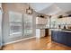 Bright kitchen features modern appliances, an island, and a breakfast nook with natural light at 16376 Flintlock Ct, Parker, CO 80134