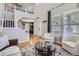 A view of a open-concept living room with lots of light and hard wood floors at 16376 Flintlock Ct, Parker, CO 80134