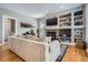 Cozy living room with a fireplace, built-in shelves, and comfortable seating at 16376 Flintlock Ct, Parker, CO 80134