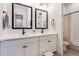 Modern bathroom with double vanity, black matte fixtures and a separate shower at 14319 Hop Clover St, Parker, CO 80134