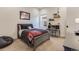 Cozy bedroom with gray bed frame, window, and built-in desk at 14319 Hop Clover St, Parker, CO 80134