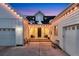 Inviting front entry with two comfortable chairs and warm lighting at 14319 Hop Clover St, Parker, CO 80134