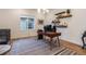 Bright and airy home office features a large desk and plenty of storage at 14319 Hop Clover St, Parker, CO 80134