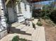 Backyard with cement patio and four stairs leading up to the back door at 54 E Cornell Ave, Englewood, CO 80113
