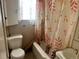 Bathroom with shower and tub and a patterned shower curtain at 54 E Cornell Ave, Englewood, CO 80113