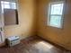 Bedroom with hardwood floors and window with AC unit at 54 E Cornell Ave, Englewood, CO 80113