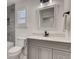 Bathroom featuring a bathtub and shower combo, decorative tile and neutral color palette at 536 Cook St, Denver, CO 80206