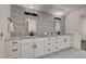 Bathroom featuring double vanities, decorative tile, and modern fixtures at 536 Cook St, Denver, CO 80206