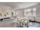 Open concept bedroom with sitting area, hardwood floors, and lots of natural light at 536 Cook St, Denver, CO 80206