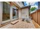 Outdoor patio with brick pavers and white table and chairs at 536 Cook St, Denver, CO 80206