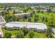 Scenic aerial view of the community with golf course, lake, and multiple residential buildings at 9320 E Center Ave # 4B, Denver, CO 80247