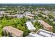 Expansive aerial shot of an apartment complex with golf course, showing lush greenery and building rooftops at 9320 E Center Ave # 4B, Denver, CO 80247