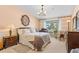 Bright bedroom with large window, neutral walls, and traditional decor at 9320 E Center Ave # 4B, Denver, CO 80247