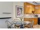 Cozy dining area with a round table, wooden chairs, and stylish decor at 9320 E Center Ave # 4B, Denver, CO 80247