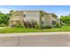 Well-maintained two-story building with lush landscaping and convenient parking spaces at 9320 E Center Ave # 4B, Denver, CO 80247