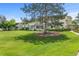 Lush green lawn with mature trees and manicured landscaping, creating a tranquil outdoor setting at 9320 E Center Ave # 4B, Denver, CO 80247