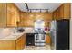 Updated kitchen with stainless steel appliances, granite counters, and ample cabinet space at 9320 E Center Ave # 4B, Denver, CO 80247