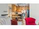 Inviting kitchen with wooden cabinets, black appliances, and eat-in dining area at 9320 E Center Ave # 4B, Denver, CO 80247