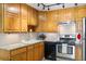 Well-lit kitchen featuring stainless steel appliances, granite countertops, and plenty of cabinet space at 9320 E Center Ave # 4B, Denver, CO 80247