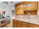 Well-appointed kitchen featuring granite countertops, wooden cabinetry, and modern fixtures at 9320 E Center Ave # 4B, Denver, CO 80247